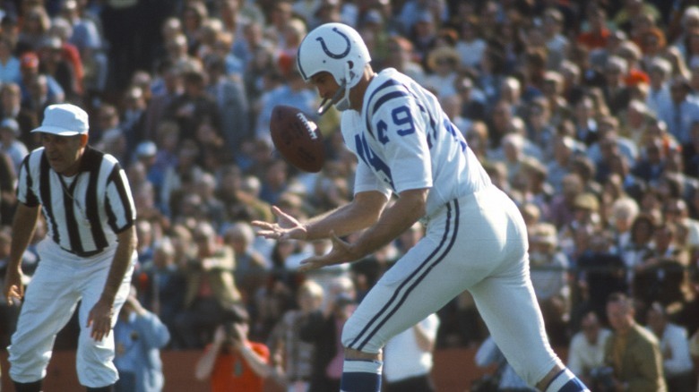 Baltimore Colts player bobbling ball