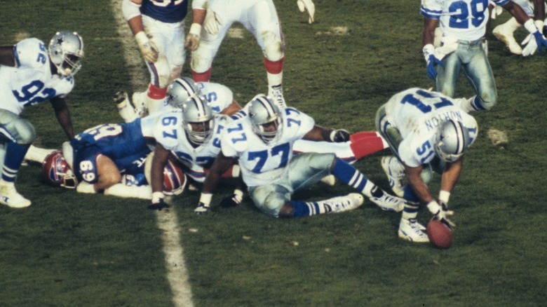Cowboys defensive lineman recovering fumble