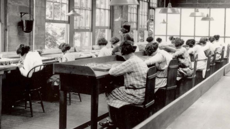 A photo of women using radium paint with no protection