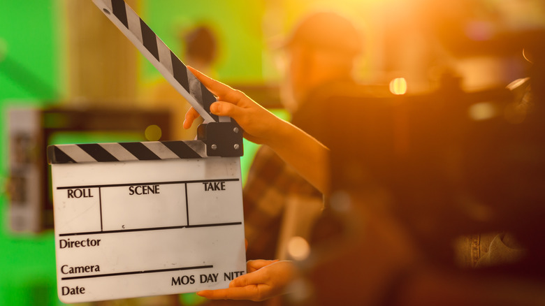 Director holding clapper
