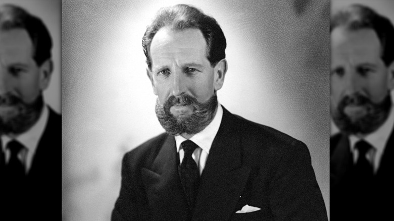Portrait of Vernon Berrange dark suit beard