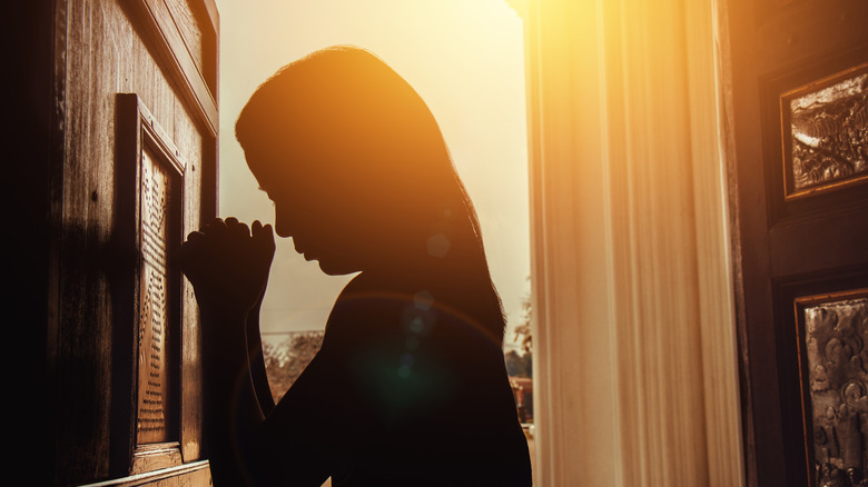 woman at confessional 