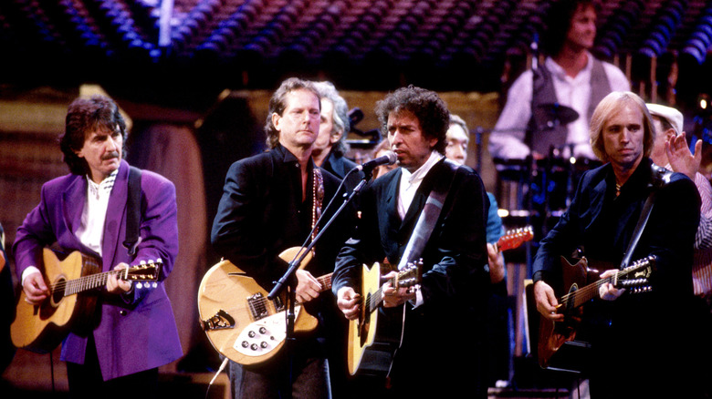 George Harrison, Tom Petty, Bob Dylan, and others on stage
