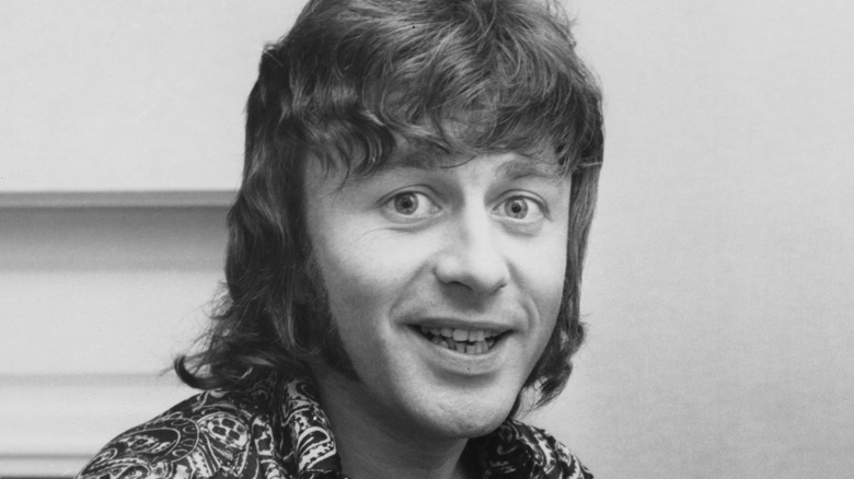 Tony Burrows at piano making funny face