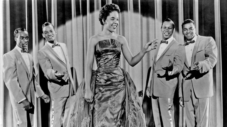 members of the Platters posing onstage
