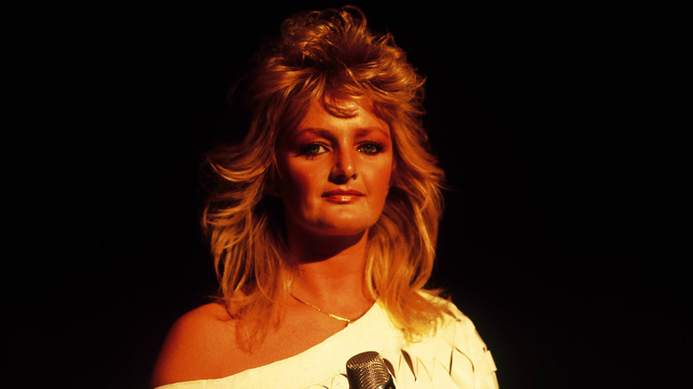 Bonnie Tyler quietly smiling at camera