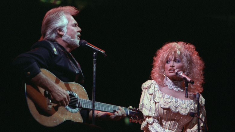 Kenny Rogers and Dolly Parton performing together on stage