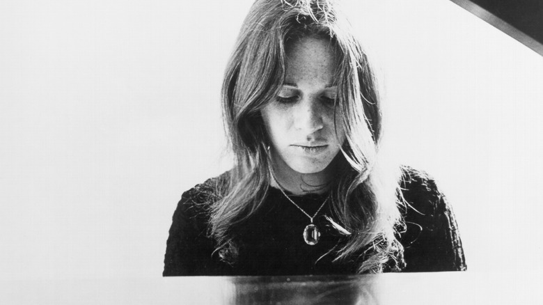 Carole King sits at piano, c. 1970