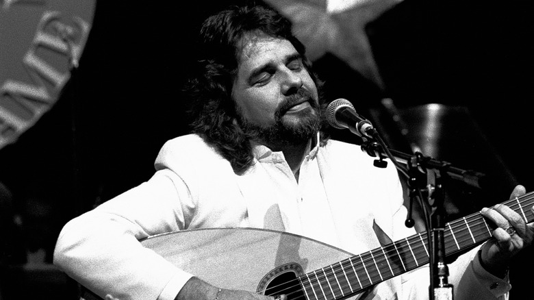 Bertie Higgins playing guitar with eyes closed