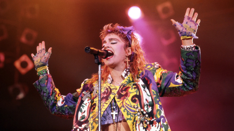 Madonna singing onstage in the 80s