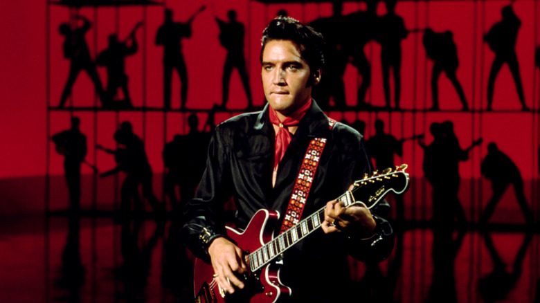 Elvis Presley playing guitar