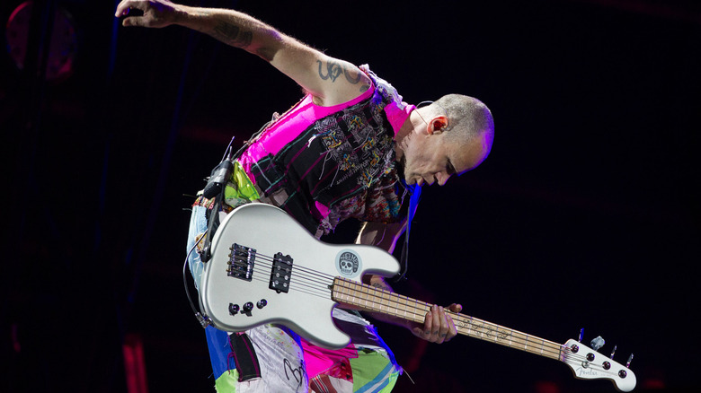 Flea playing bass onstage