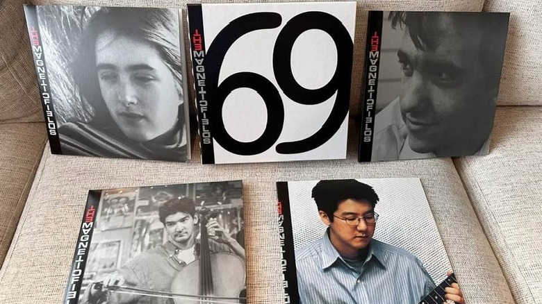 The five-record set that makes up the Magnetic Fields' "69 Love Songs" album spread out on a couch.