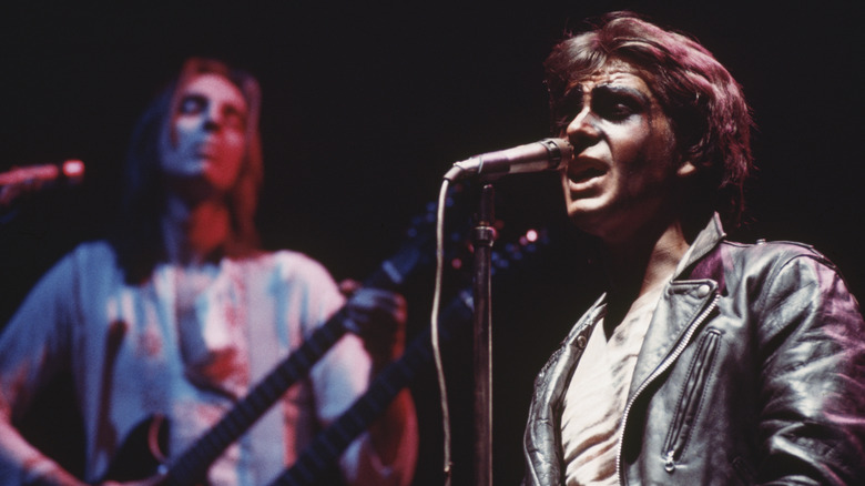 Peter Gabriel and Genesis playing live on stage