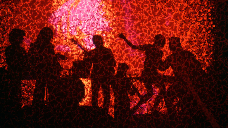 Silhouettes dancing against spotted foreground