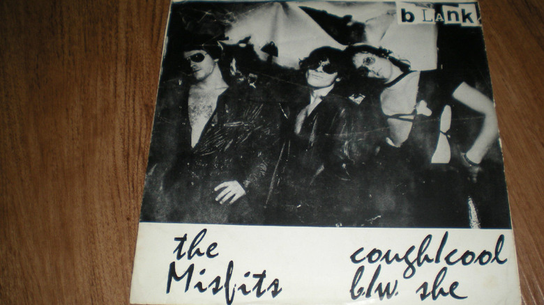 Cough/Cool/She album on wooden table