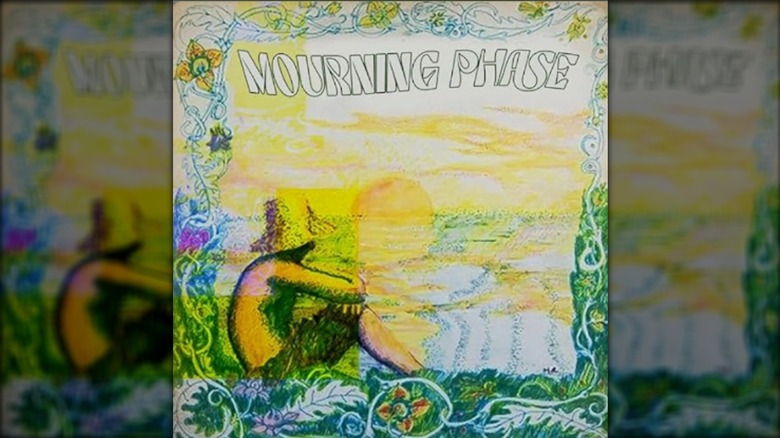 Mourning Phase album art showing shirtless man sat wearing a hat with sun on horizon