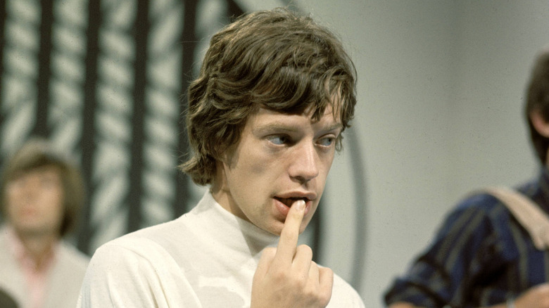 Mick Jagger with finger in mouth on TV in 1965
