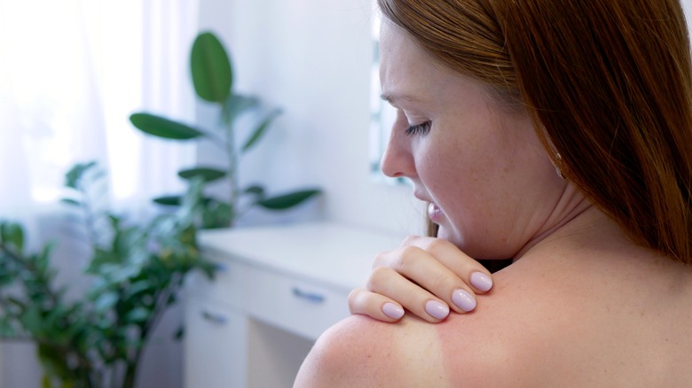 Sunburnt redhead woman