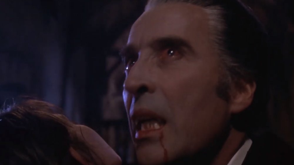 Christopher Lee takes a bite out of Caroline Munro