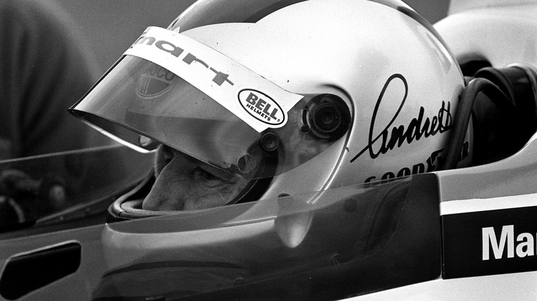 mario andretti sitting in car
