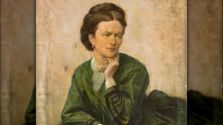 Portrait of woman wearing a green dress