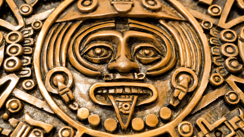 aztec god engraving