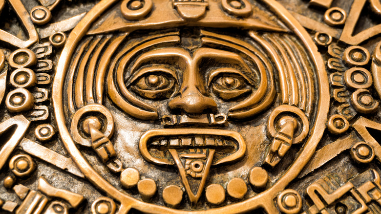 aztec god engraving