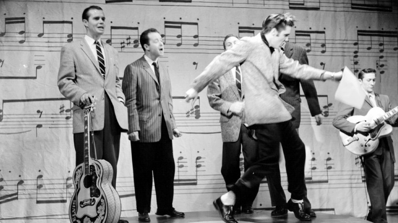 Elvis Presley on stage with band
