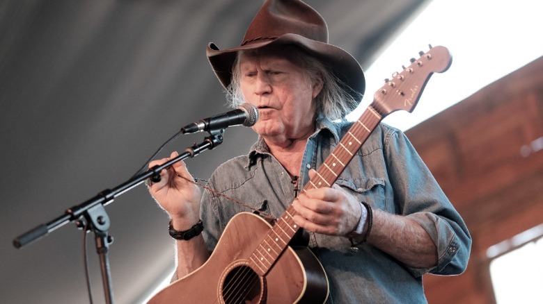 Billy Joe Shaver onstage playing guitar