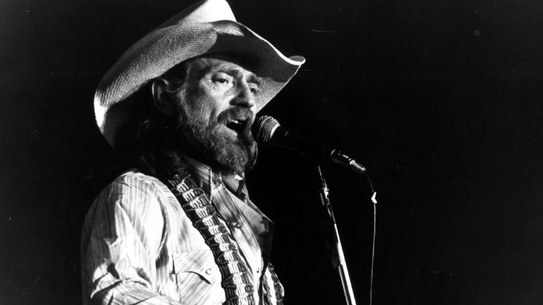 Willie Nelson onstage singing