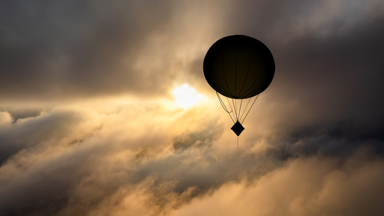 Spy balloon floating during sunset
