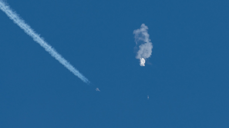 F-22 zooming by destroyed balloon