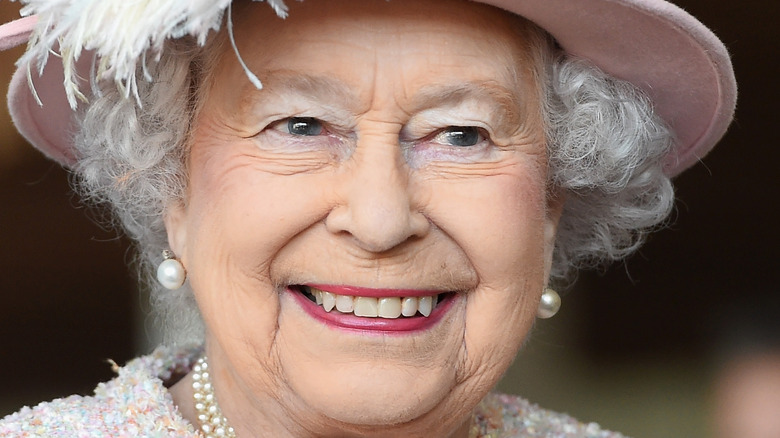 Queen Elizabeth II in feathered hat 