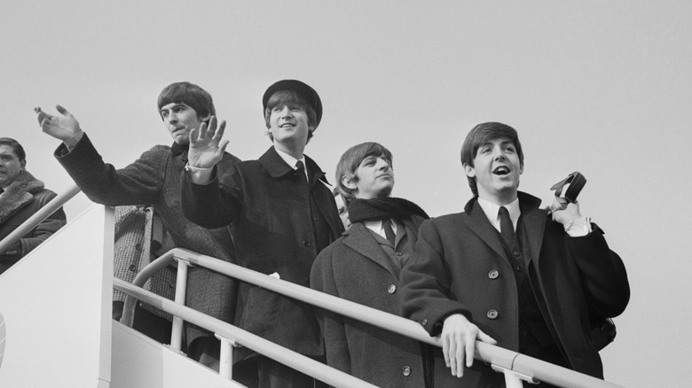 The Beatles arriving in America in 1964