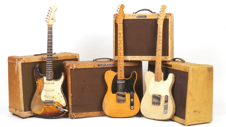 Assorted Fender guitars and amplifiers posed for display