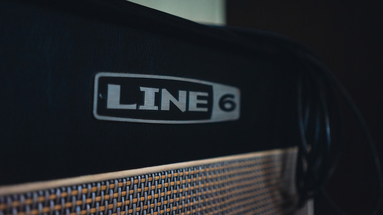 Instrument cables rest atop a Line 6 amplifier