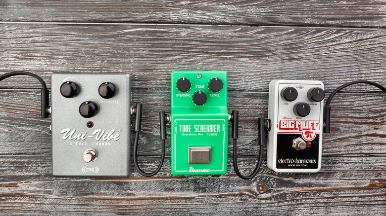Analog pedals rest on wooden floor