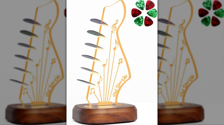 Light up guitar pick holder shaped like a guitar headstock