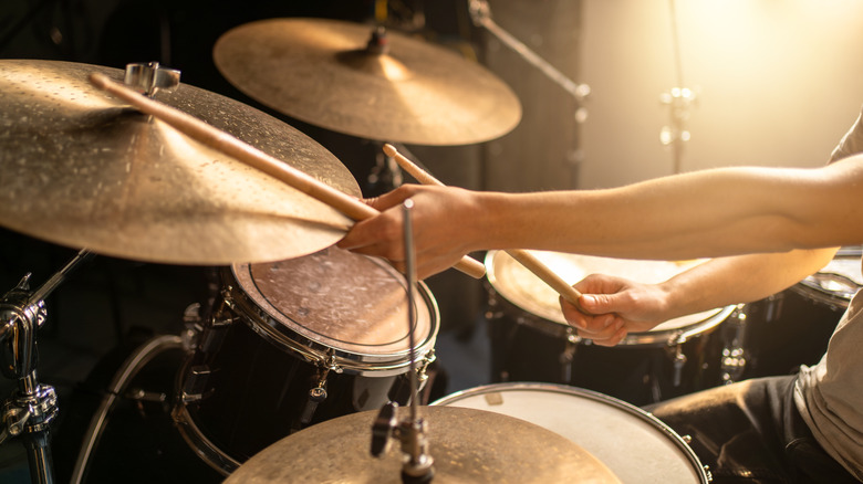 Drummer hitting drums