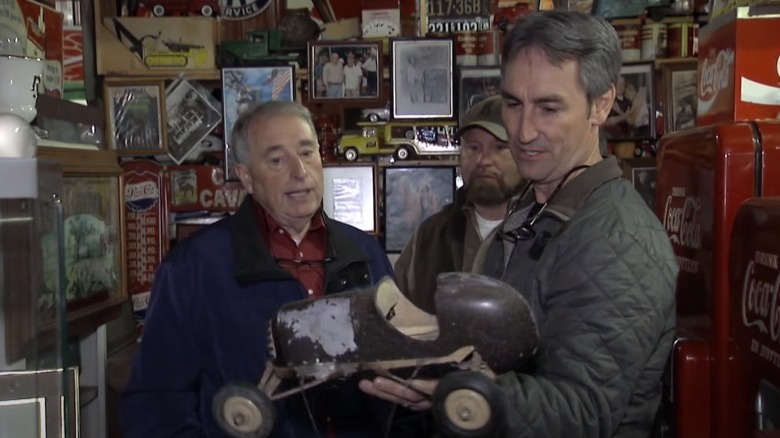 Mike Wolfe holding toy car