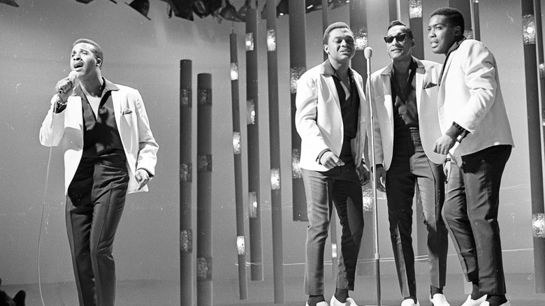 The Four Tops performing on stage.