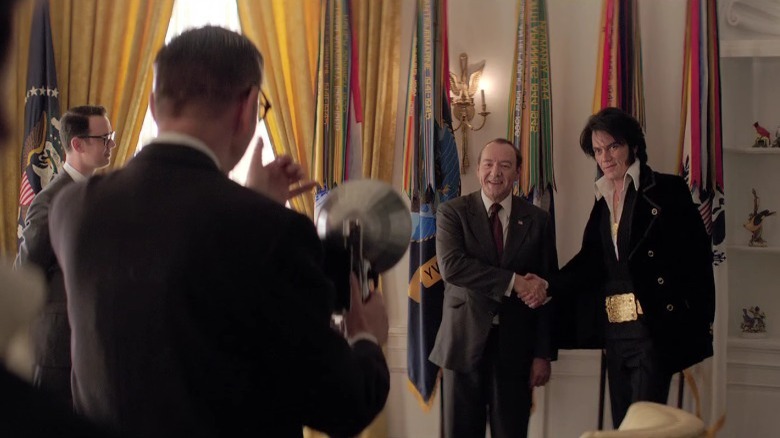 Nixon and Elvis prepare to have their famous photo taken
