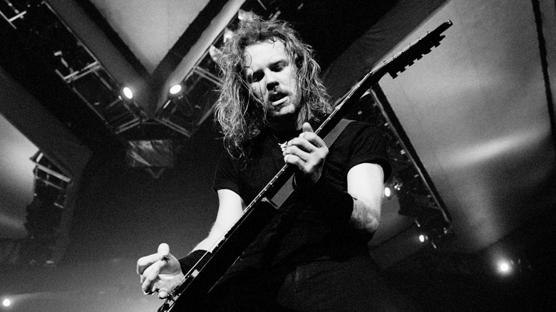 James Hetfield playing guitar on stage
