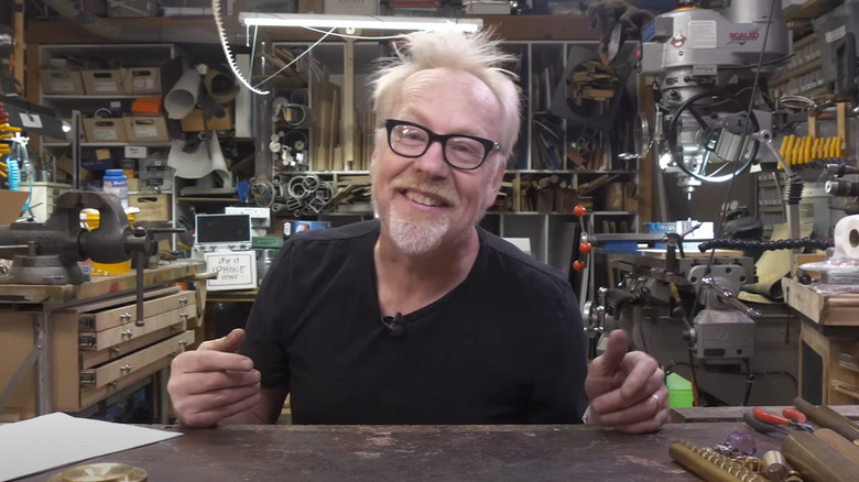 Adam Savage sitting at workbench