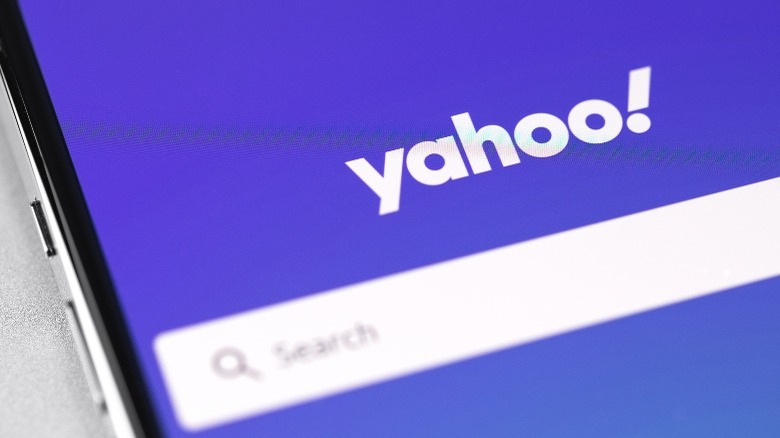 Yahoo logo website on phone screen