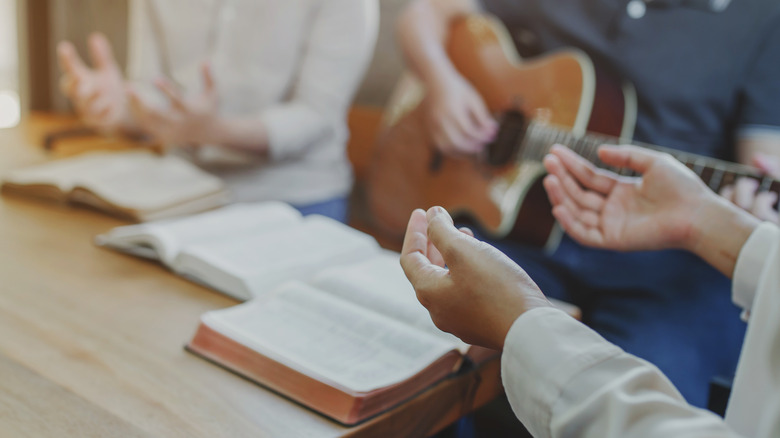 Christians playing guitar and singing