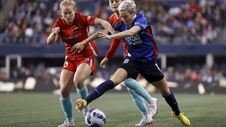 Megan Rapinoe kicking soccer ball