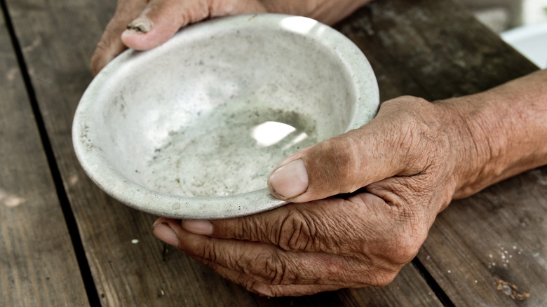 Old hands with bowl