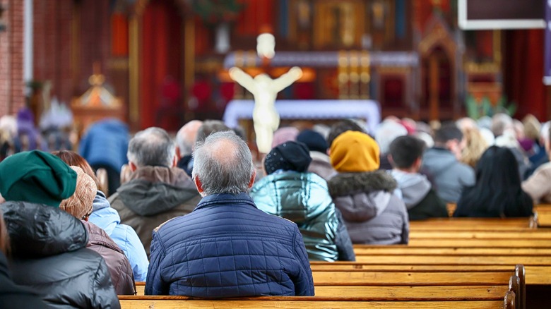 people sitting in pews cathedral
